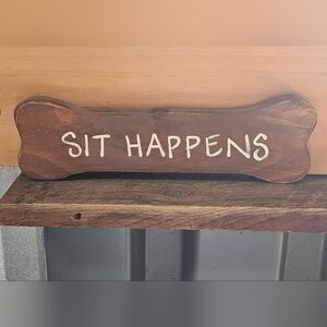 Wooden Sign with 'Sit Happens' Text